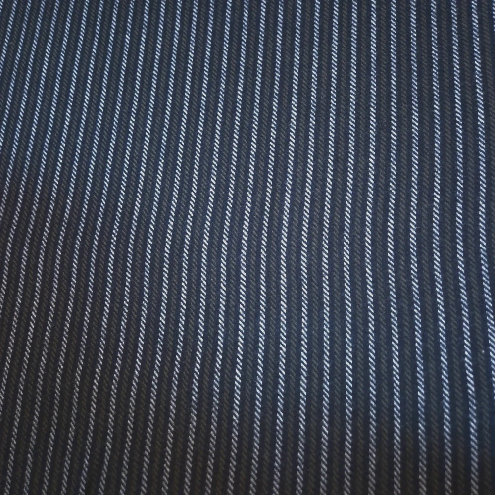 Vlněná látka černo-bílo-zelená pruhovaná