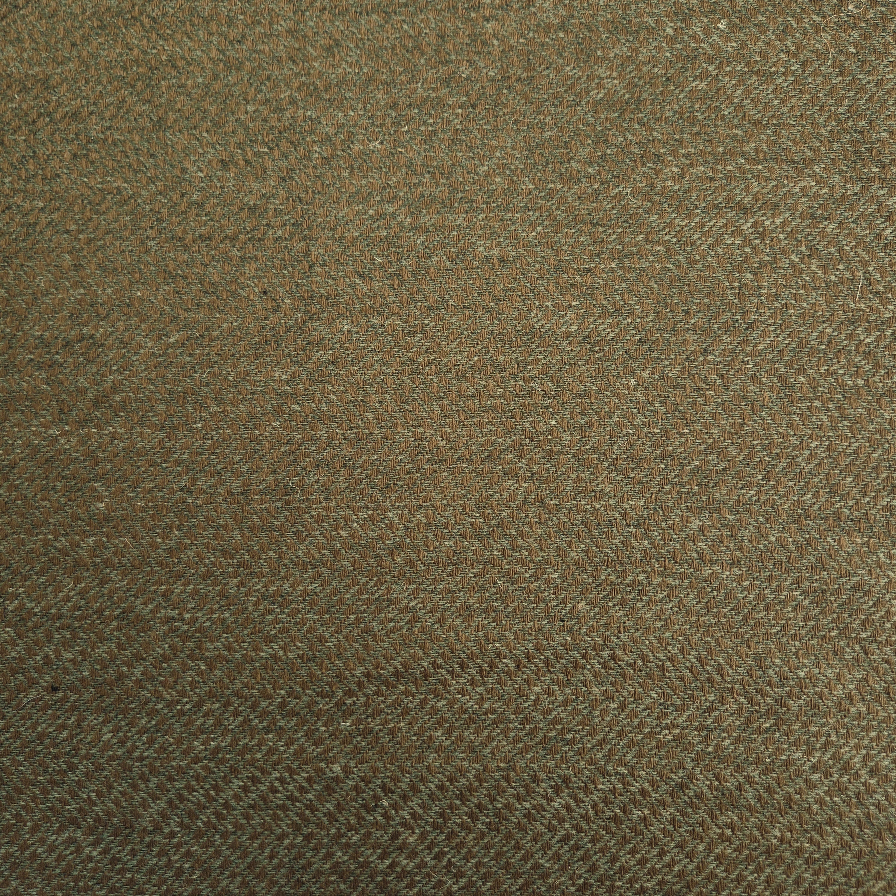 Vlněná látka tkaná do rybí kosti zeleno-hnědá