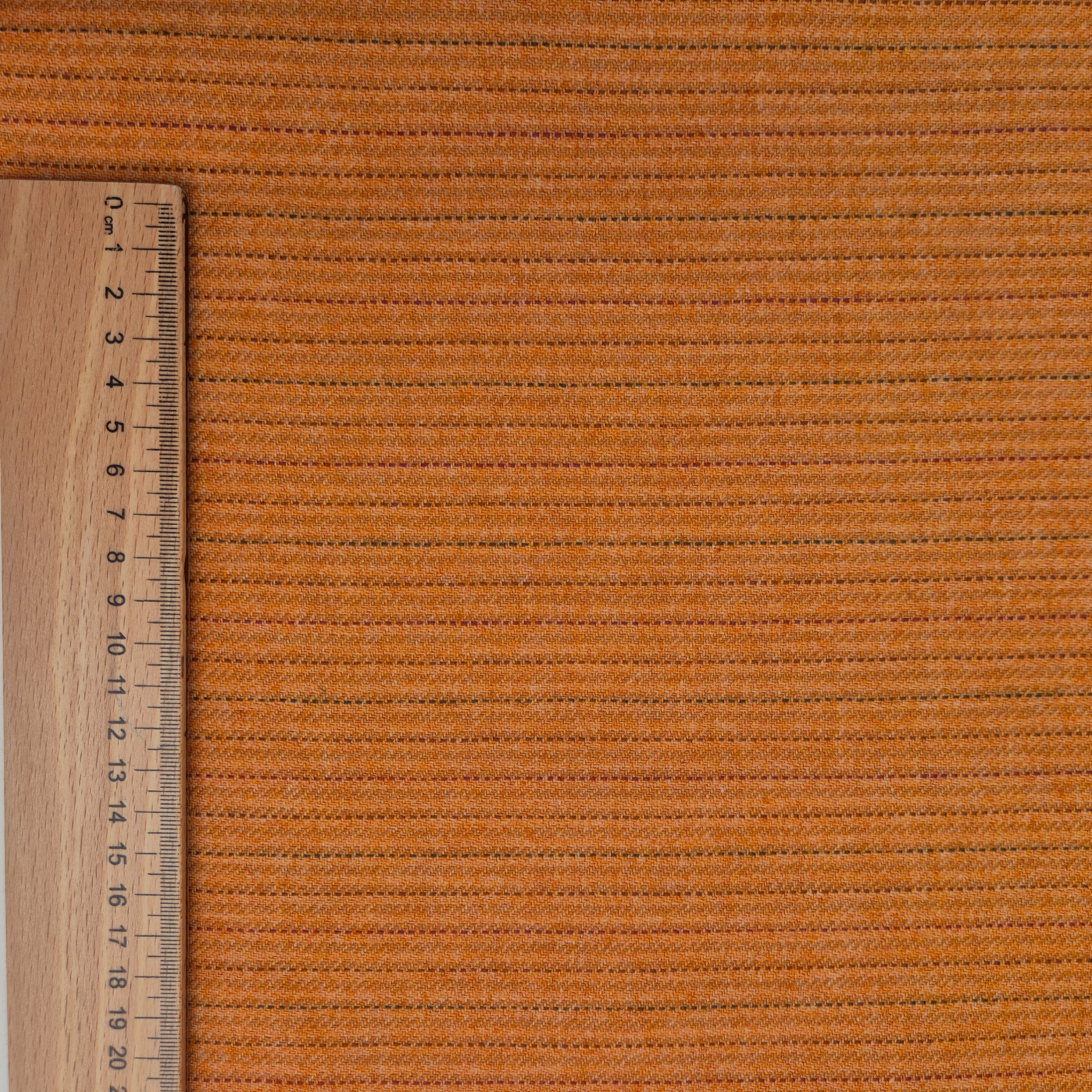 Vlněná látka oranžová s přerušovanými proužky
