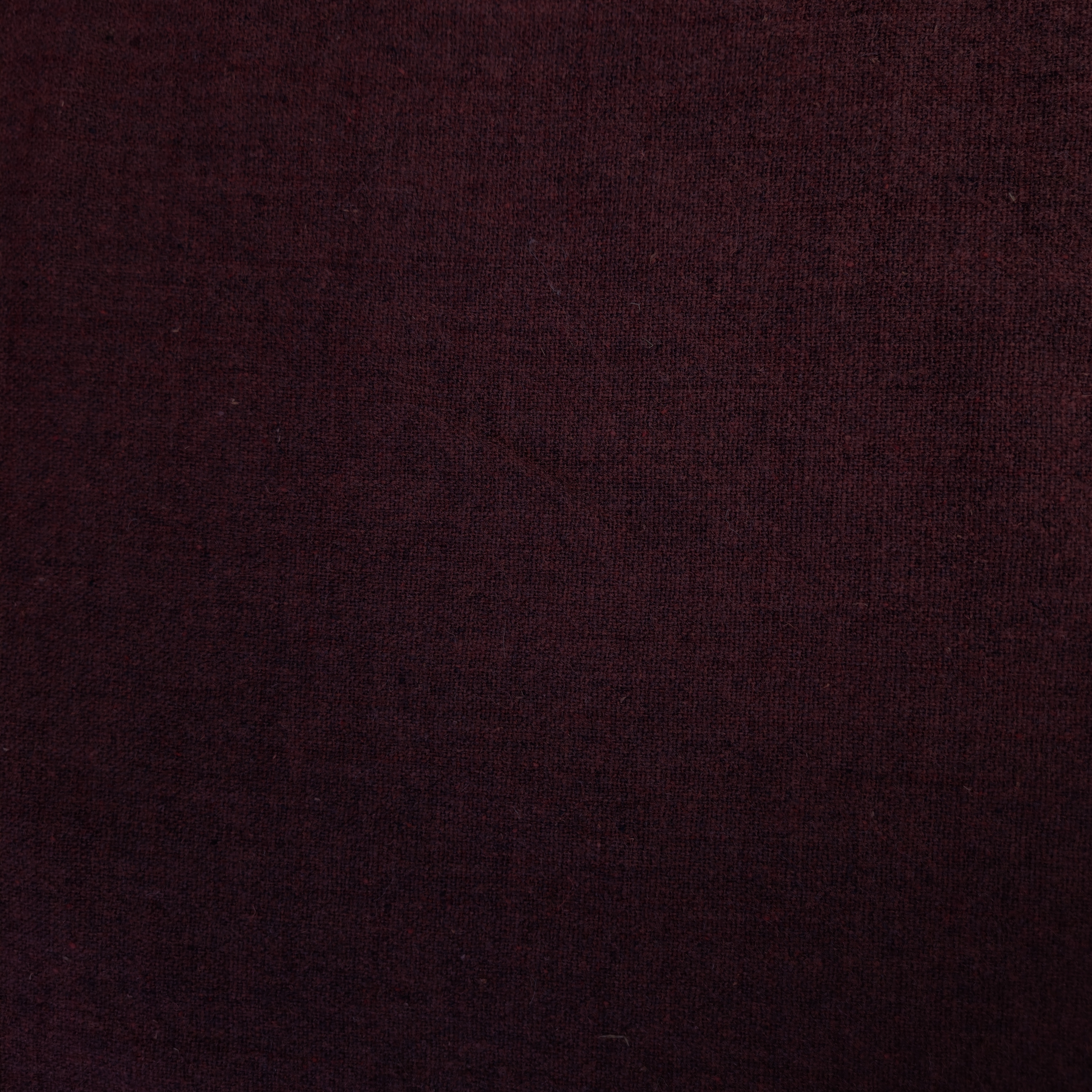 Vlněná látka tmavě cihlová